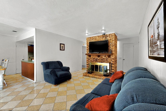 3714 Burning Tree Ln, Garland, TX 75042 - living area with a textured ceiling, a fireplace, and light tile patterned floors