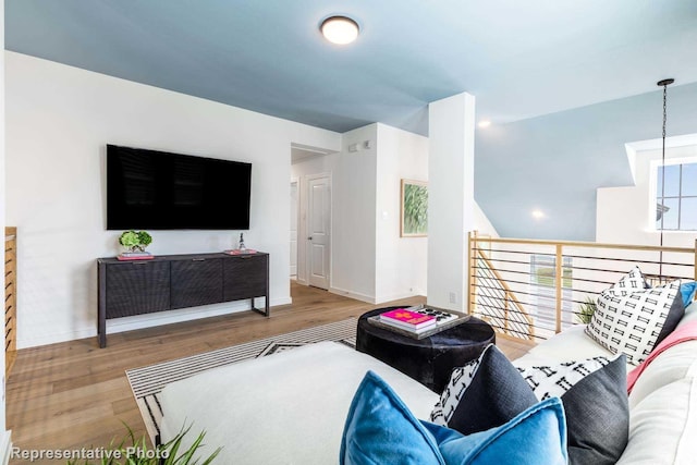 living room with wood finished floors and baseboards