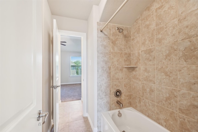 full bath featuring tile patterned floors, shower / tub combination, and baseboards
