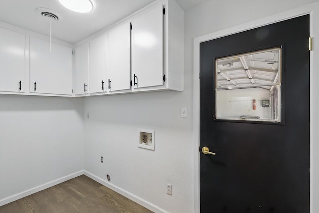 4512 Starlight Dr, Haltom City, TX 76117 - clothes washing area with cabinet space, dark wood-type flooring, baseboards, and washer hookup
