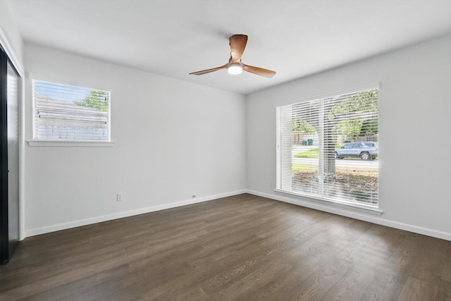 4512 Starlight Dr, Haltom City, TX 76117 - unfurnished room with plenty of natural light, dark wood-style floors, ceiling fan, and baseboards