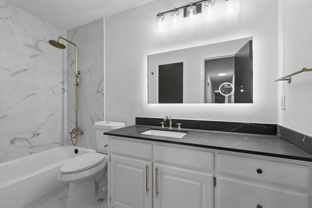 4512 Starlight Dr, Haltom City, TX 76117 - full bathroom with toilet, vanity, a textured wall, marble look tiles, and bathtub / shower combination