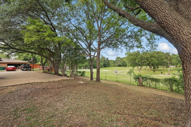 4512 Starlight Dr, Haltom City, TX 76117 - view of yard featuring fence and a carport