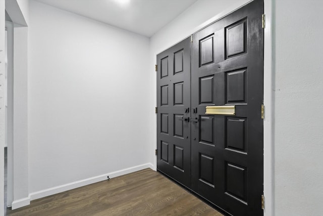 4512 Starlight Dr, Haltom City, TX 76117 - foyer entrance with dark wood-type flooring and baseboards
