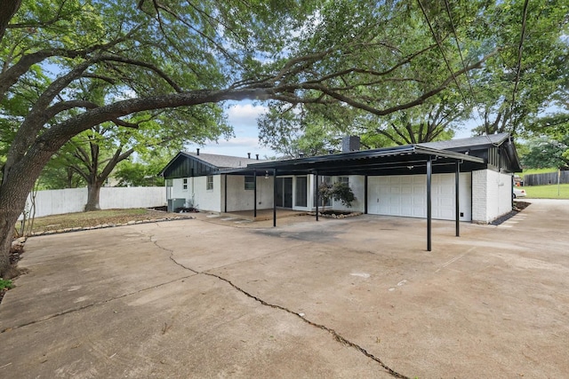 4512 Starlight Dr, Haltom City, TX 76117 - view of front of home featuring a garage, driveway, fence, brick siding, and a chimney