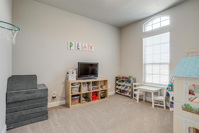 playroom featuring carpet and baseboards