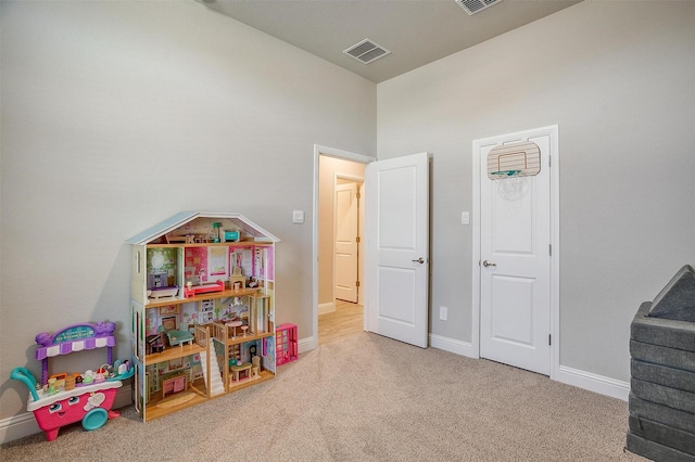 game room featuring carpet floors and baseboards