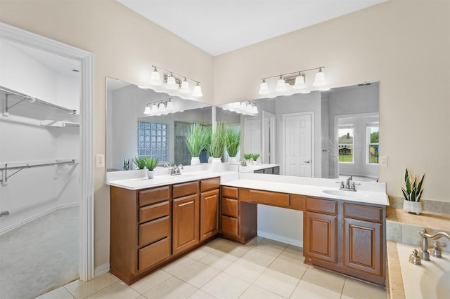 2701 Royal Troon Dr, Plano, TX 75025 - full bathroom with double vanity, tile patterned floors, a spacious closet, and a bath