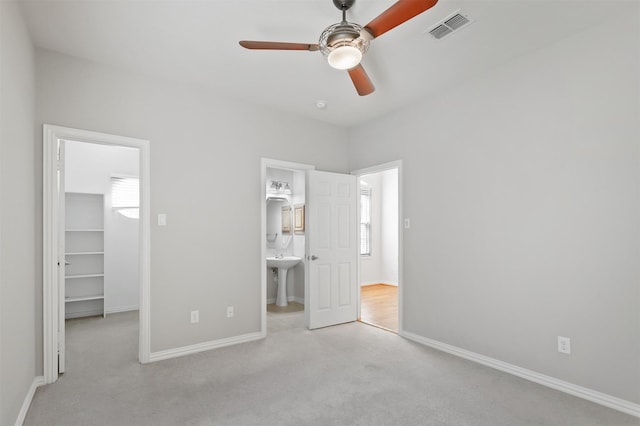 2701 Royal Troon Dr, Plano, TX 75025 - unfurnished bedroom featuring a spacious closet, carpet floors, baseboards, a closet, and ensuite bath
