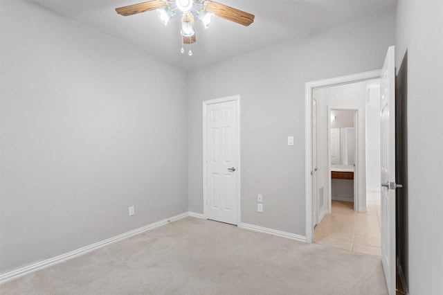 2701 Royal Troon Dr, Plano, TX 75025 - unfurnished bedroom with light carpet, baseboards, and ceiling fan