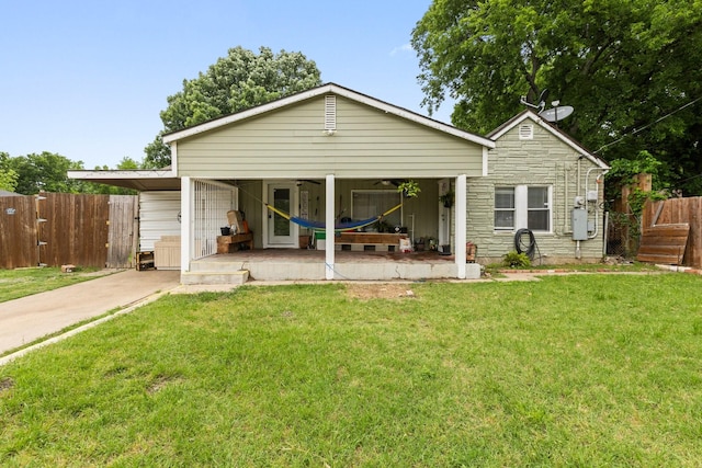 2135 Custer Dr, Dallas, TX 75216 - rear view of property with a ceiling fan, stone siding, and driveway