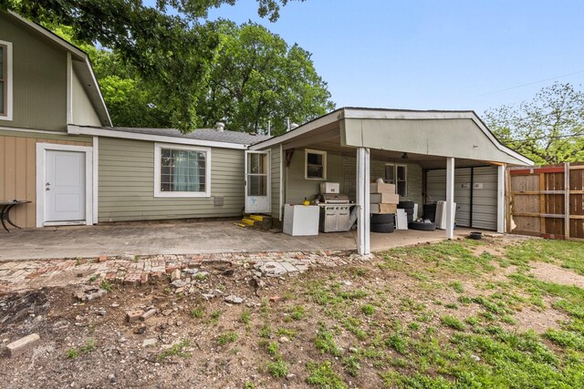 2135 Custer Dr, Dallas, TX 75216 - rear view of property featuring fence and a patio area