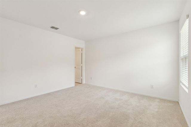 7709 Lindheimer Ln, Mckinney, TX 75071 - unfurnished room featuring light carpet, healthy amount of natural light, and baseboards