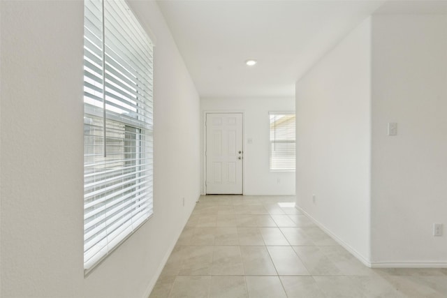 7709 Lindheimer Ln, Mckinney, TX 75071 - corridor with light tile patterned flooring and baseboards
