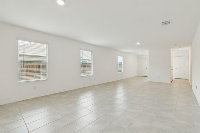 7709 Lindheimer Ln, Mckinney, TX 75071 - spare room with light tile patterned floors and recessed lighting