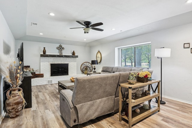 3206 S Fm 51, Decatur, TX 76234 - living area with light wood finished floors, ceiling fan, a brick fireplace, and recessed lighting
