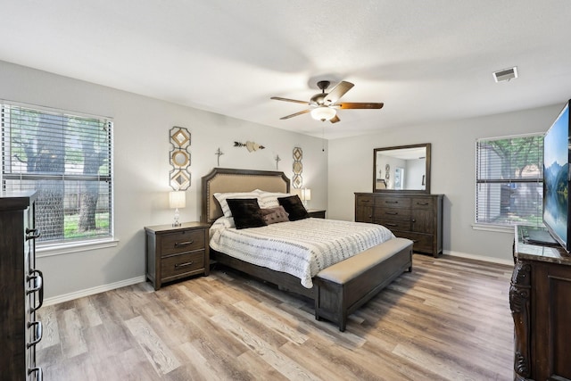 3206 S Fm 51, Decatur, TX 76234 - bedroom featuring light wood-style flooring, baseboards, and ceiling fan