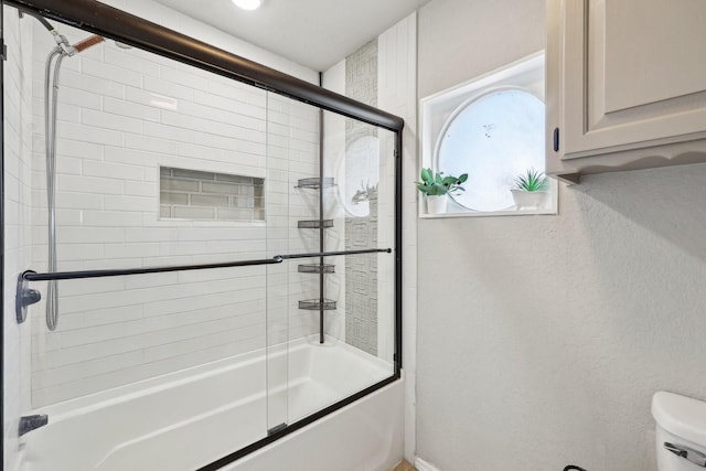 3206 S Fm 51, Decatur, TX 76234 - full bath featuring combined bath / shower with glass door, toilet, and a textured wall