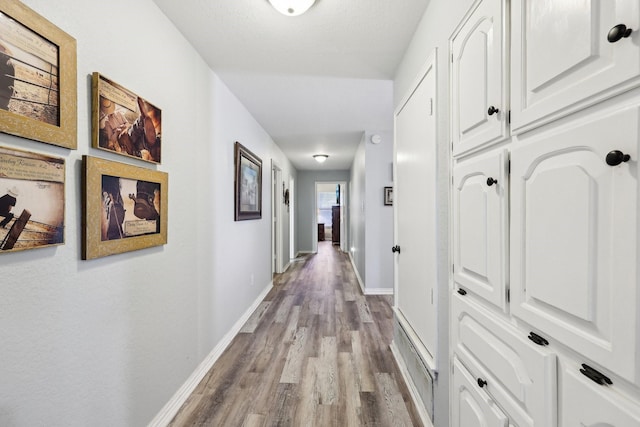 3206 S Fm 51, Decatur, TX 76234 - hall featuring wood finished floors and baseboards