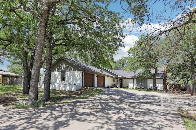 3206 S Fm 51, Decatur, TX 76234 - view of front of property featuring an attached garage, fence, and concrete driveway