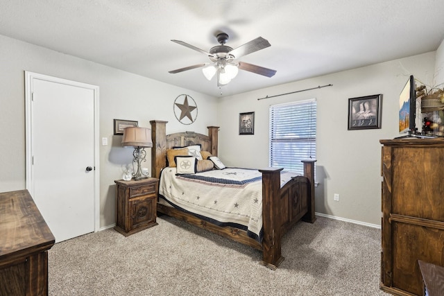 3206 S Fm 51, Decatur, TX 76234 - bedroom with light colored carpet, baseboards, and ceiling fan