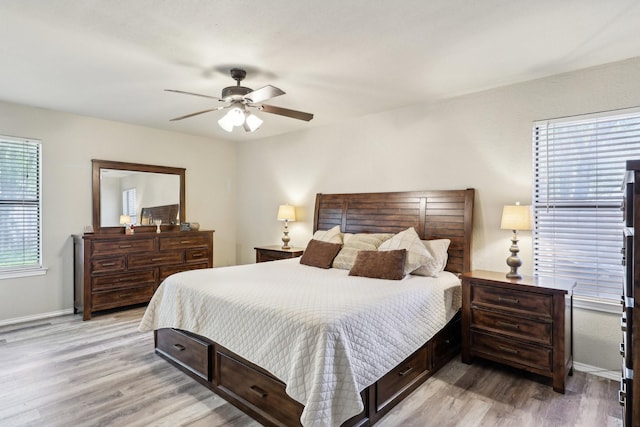 3206 S Fm 51, Decatur, TX 76234 - bedroom featuring light wood-style flooring, baseboards, and a ceiling fan