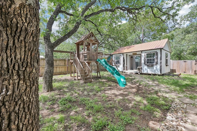 3206 S Fm 51, Decatur, TX 76234 - view of play area with a fenced backyard and an outbuilding