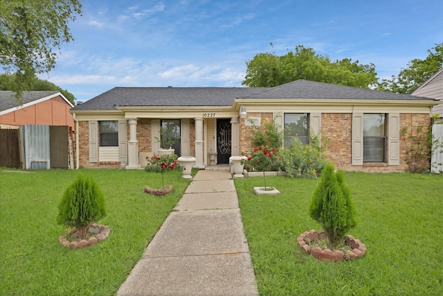 10227 Oak Gate Ln, Dallas, TX 75217 - view of front facade with brick siding and roof with shingles