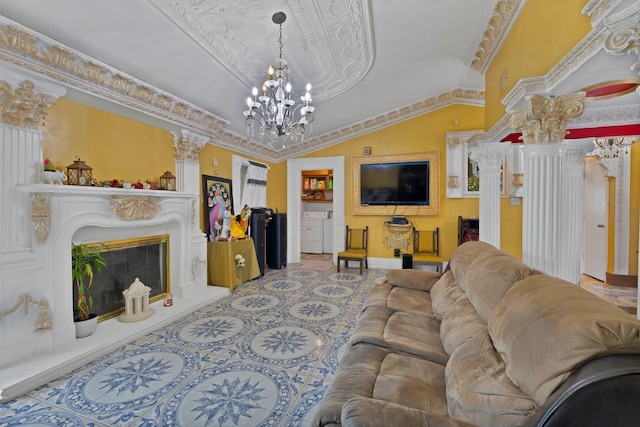 10227 Oak Gate Ln, Dallas, TX 75217 - tiled living area featuring decorative columns, washer / clothes dryer, vaulted ceiling, a chandelier, and baseboards
