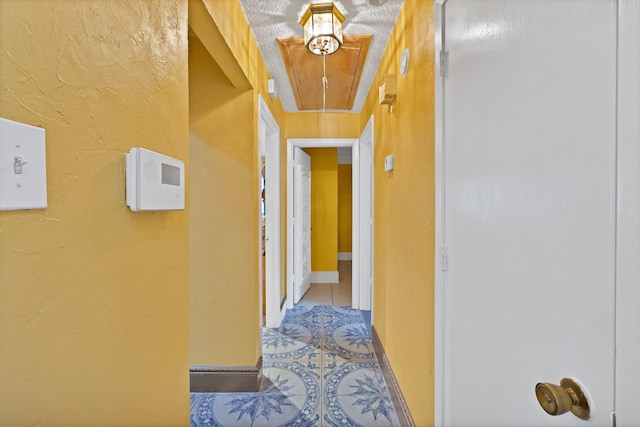 10227 Oak Gate Ln, Dallas, TX 75217 - corridor with tile patterned flooring and attic access