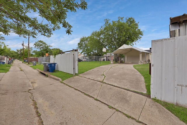 10227 Oak Gate Ln, Dallas, TX 75217 - view of home's exterior featuring concrete driveway