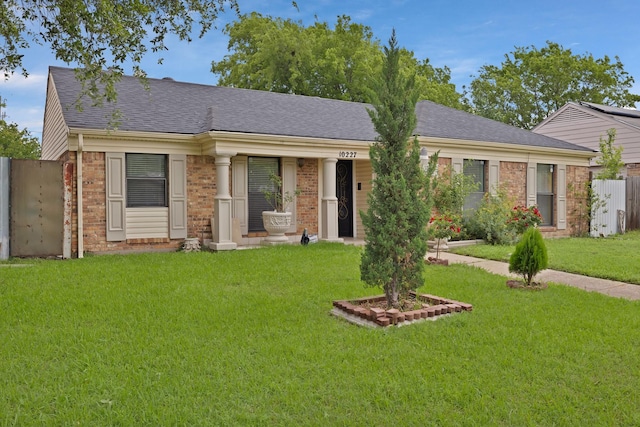 10227 Oak Gate Ln, Dallas, TX 75217 - view of front of home featuring brick siding and a shingled roof