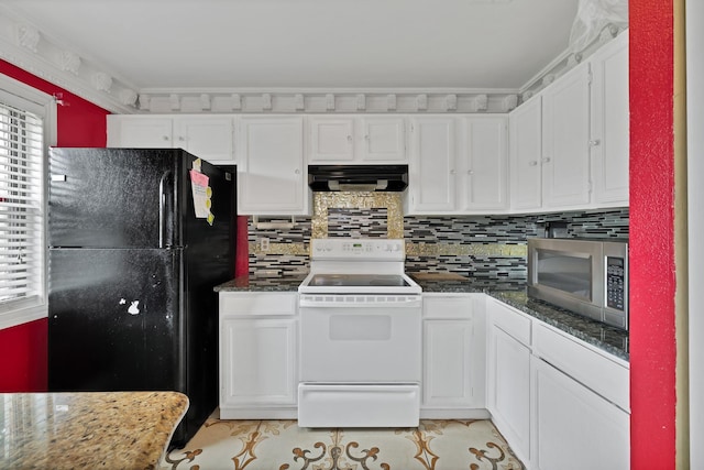 10227 Oak Gate Ln, Dallas, TX 75217 - kitchen with white range with electric stovetop, freestanding refrigerator, stainless steel microwave, extractor fan, and white cabinets