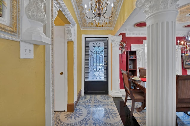 10227 Oak Gate Ln, Dallas, TX 75217 - tiled foyer entrance featuring ornate columns, a chandelier, and baseboards