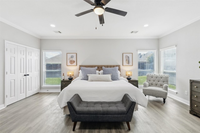 bedroom with wood finished floors, crown molding, multiple windows, baseboards, and recessed lighting