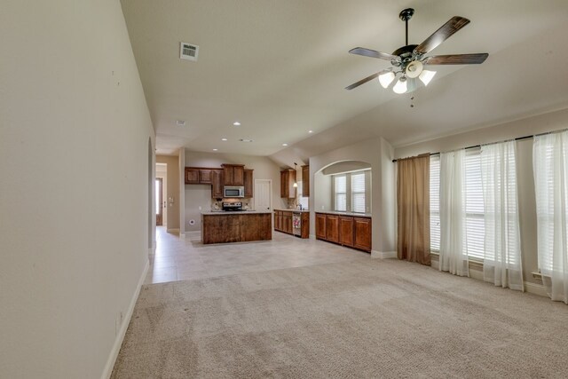1002 Star Grass Dr, Mansfield, TX 76063 - unfurnished living room with light carpet, baseboards, recessed lighting, ceiling fan, and vaulted ceiling