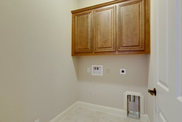 1002 Star Grass Dr, Mansfield, TX 76063 - laundry area featuring hookup for an electric dryer, cabinet space, washer hookup, gas dryer hookup, and baseboards