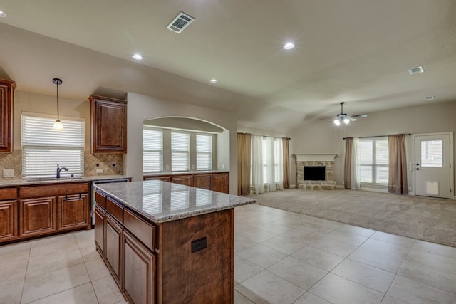 1002 Star Grass Dr, Mansfield, TX 76063 - kitchen featuring a sink, ceiling fan, light carpet, light tile patterned flooring, and recessed lighting