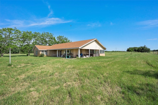 1412 US Highway 84, Teague, TX 75860 - rear view of property with a lawn