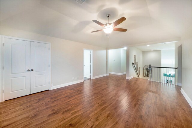 bonus room featuring a ceiling fan, wood finished floors, and baseboards