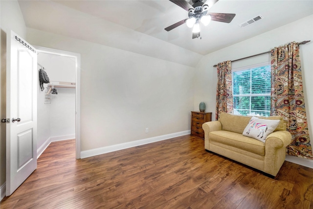living area featuring baseboards, wood finished floors, ceiling fan, and lofted ceiling