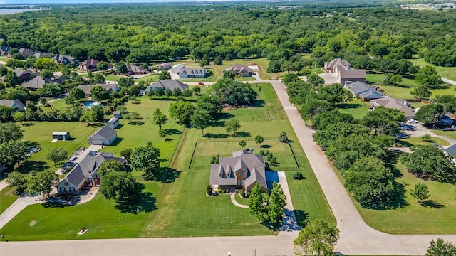 aerial perspective of suburban area with a forest