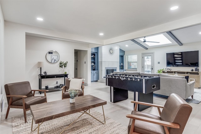 7728 La Bolsa, Dallas, TX 75248 - playroom with a skylight, recessed lighting, and a fireplace