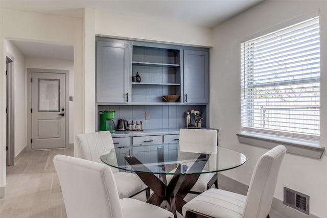 7728 La Bolsa, Dallas, TX 75248 - dining area featuring healthy amount of natural light and baseboards