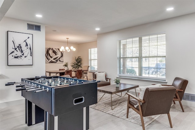 7728 La Bolsa, Dallas, TX 75248 - rec room with baseboards, a chandelier, recessed lighting, and light wood-style floors