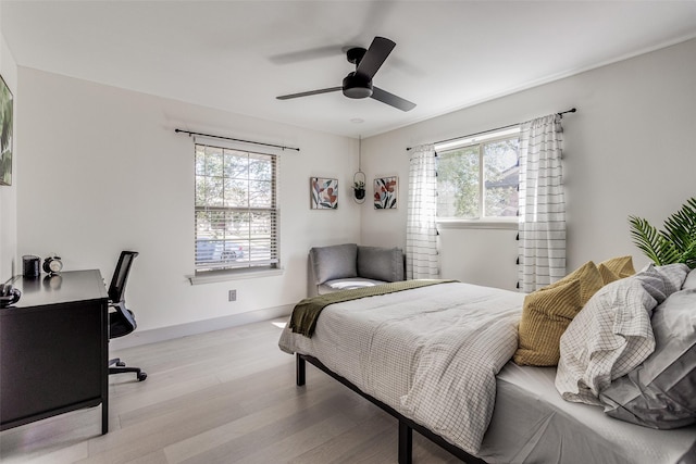 7728 La Bolsa, Dallas, TX 75248 - bedroom with wood finished floors, ceiling fan, and a desk