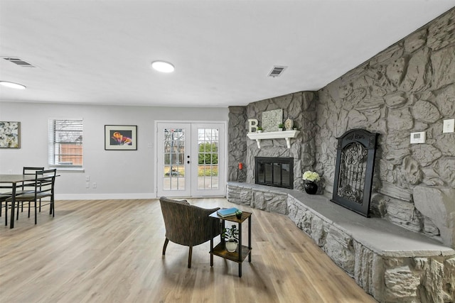 1846 Oak Hill Cir, Dallas, TX 75217 - living area with a fireplace, wood finished floors, healthy amount of natural light, and baseboards