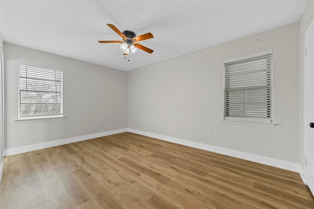 1846 Oak Hill Cir, Dallas, TX 75217 - spare room with ceiling fan, light wood-type flooring, and baseboards