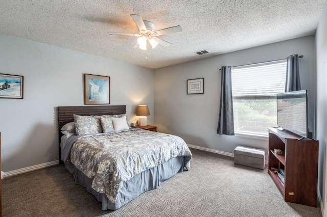 10557 Stargazer Dr, Frisco, TX 75033 - bedroom featuring carpet floors, a textured ceiling, baseboards, and a ceiling fan