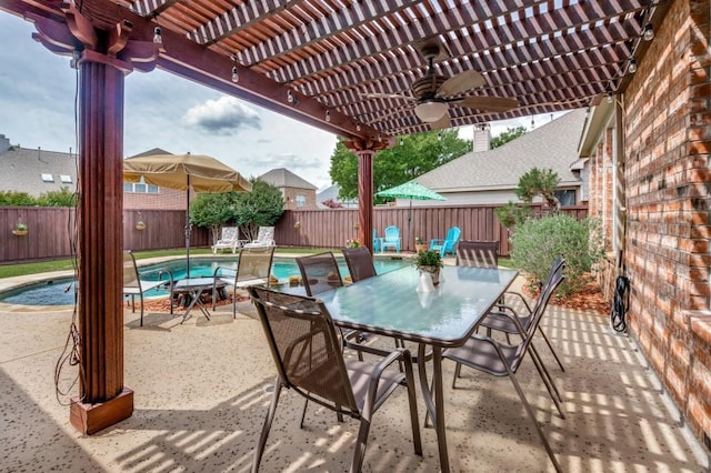 view of patio featuring outdoor dining space, a pergola, ceiling fan, and a fenced backyard